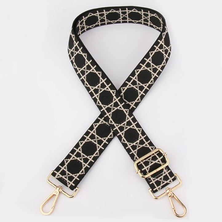 Black Tikori London Checkered Lines Crossbody Strap with adjustable length laid and stylish pattern displayed. Golden hardware also showing in the picture in a white background.