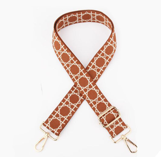 TIKORI LONDON checkered lines tan crossbody strap laid flat showing pattern and adjustable length. Golden hardware showing in a white background.