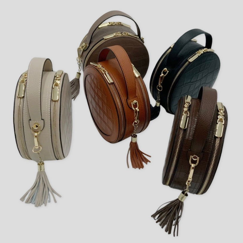  Tikori London Cleopatra leather circle crossbody bag collection with dual zippers, crafted in leather with sleek, modern design. All 5 colours showing in the picture  