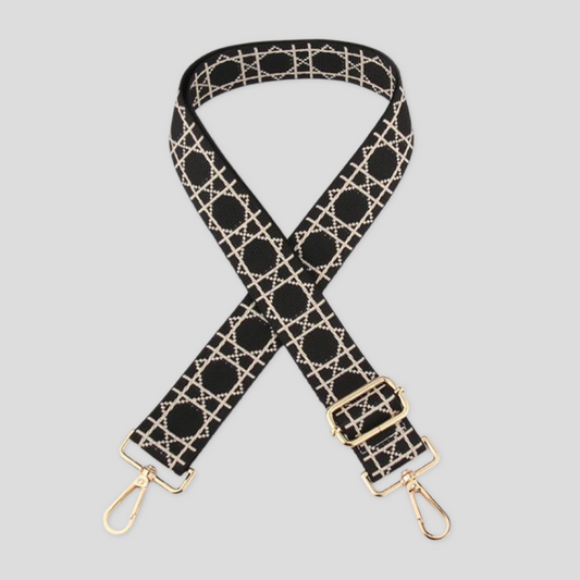 Black Tikori London Checkered Lines Crossbody Strap with adjustable length laid and stylish pattern displayed. Golden hardware also showing in the picture in a white background.