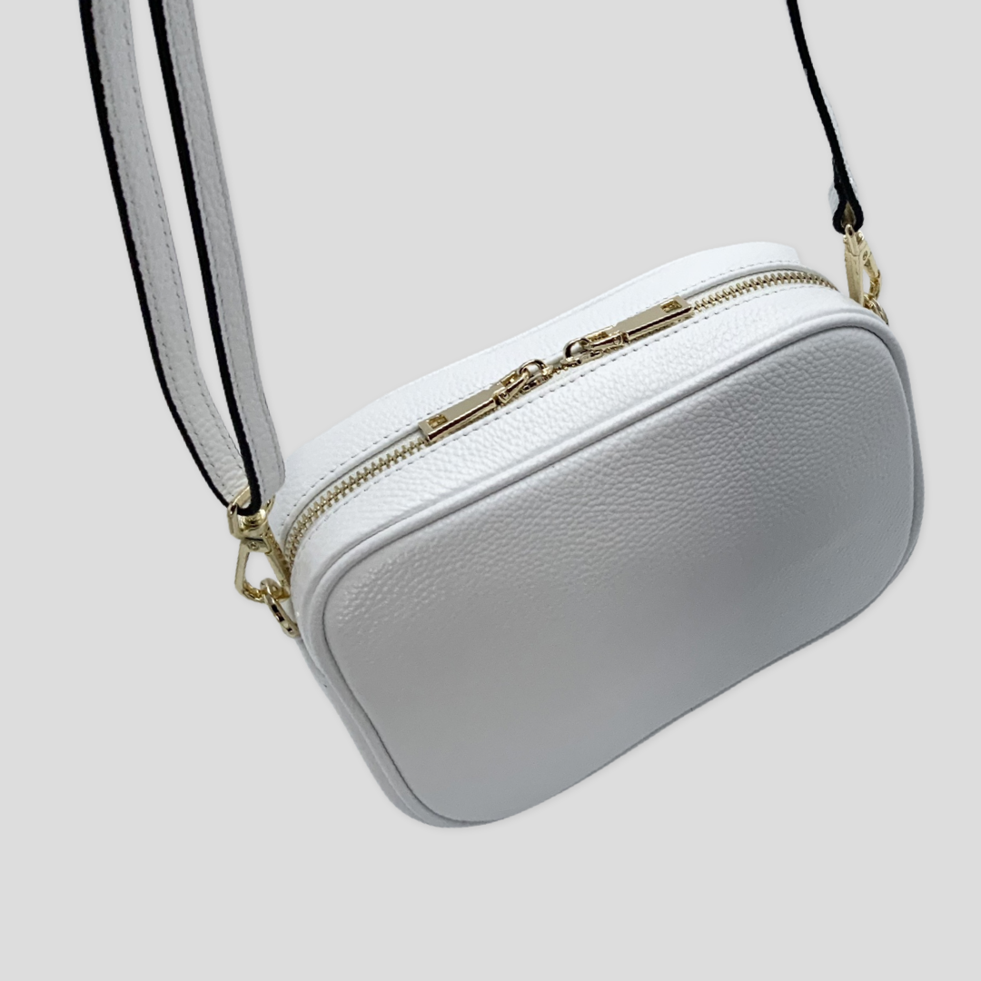 Clasdic elegance. Tikori Classic white by TIKORI london. Genuine pebbled leather cross body bag. Back profile of the Bag hanging details shows in the picture in white background. 