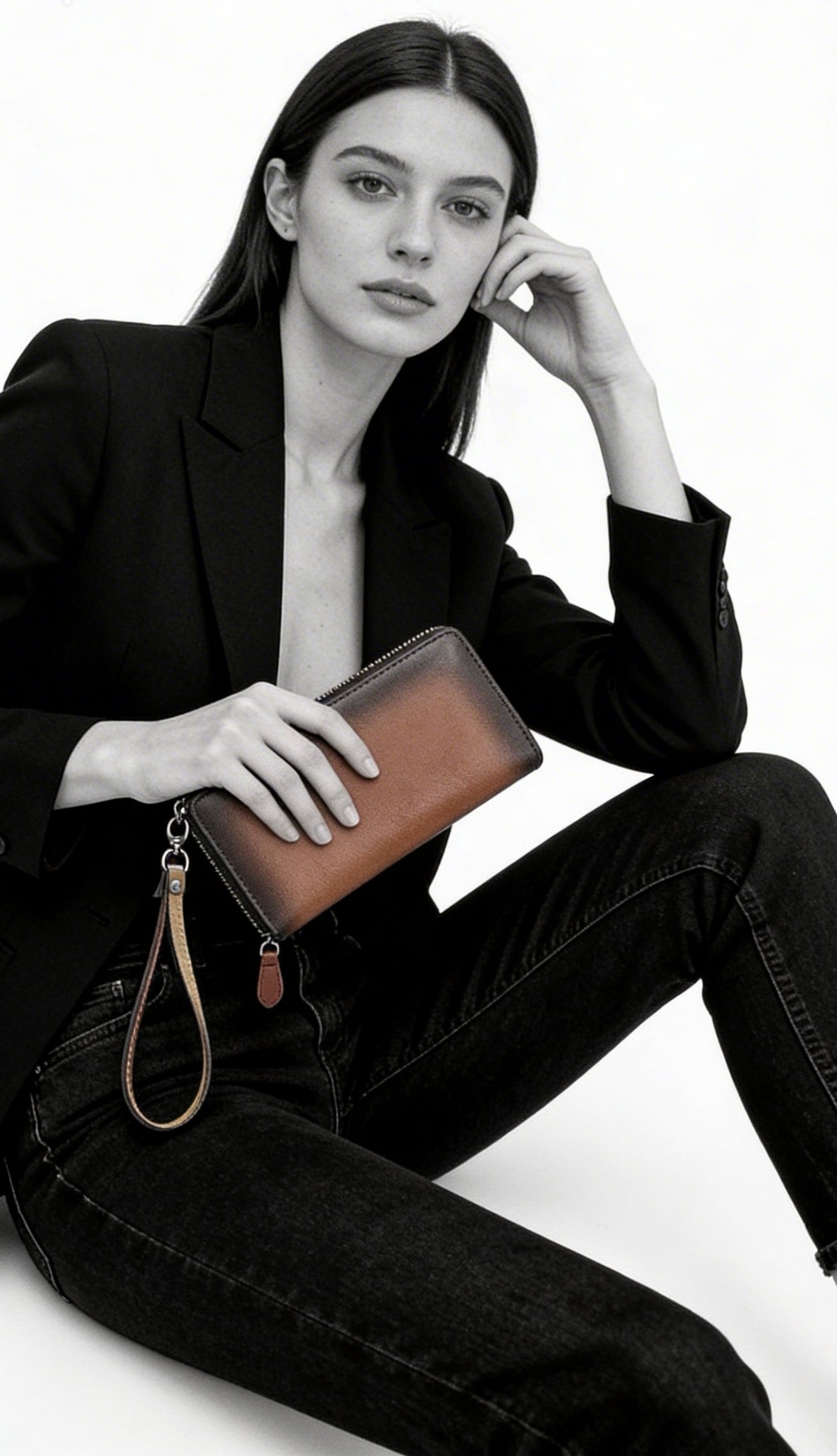 Wrist strap wallet - Orange brown model by a female model- TIKORI LONDON