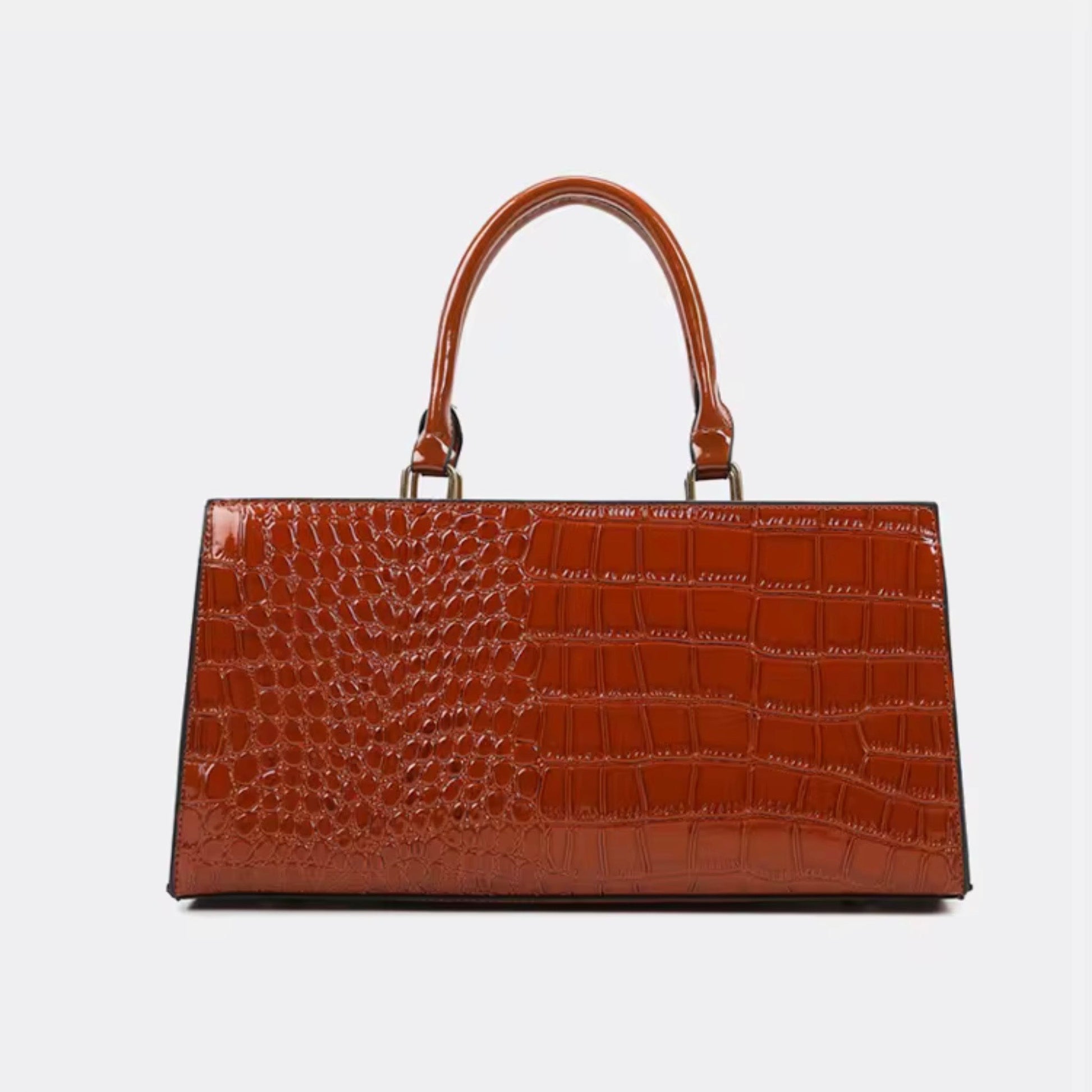 Gilded Croc Baguette - Cognac By TIKORI London. Back of the bag detail showing on the picture. Top handles detail with Golden tone hardware. In a fully white background 
