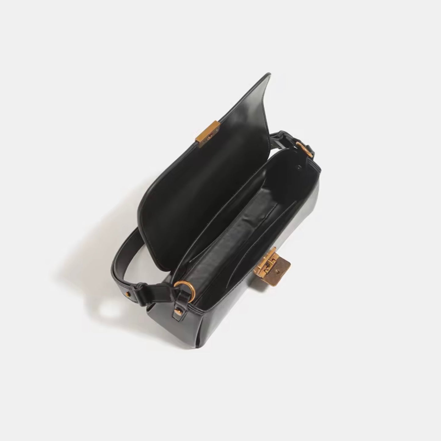 Crimson Muse Shoulder Bag - Black by TIKORI LONDON. Open bag shows inside of the bag in a white background. 