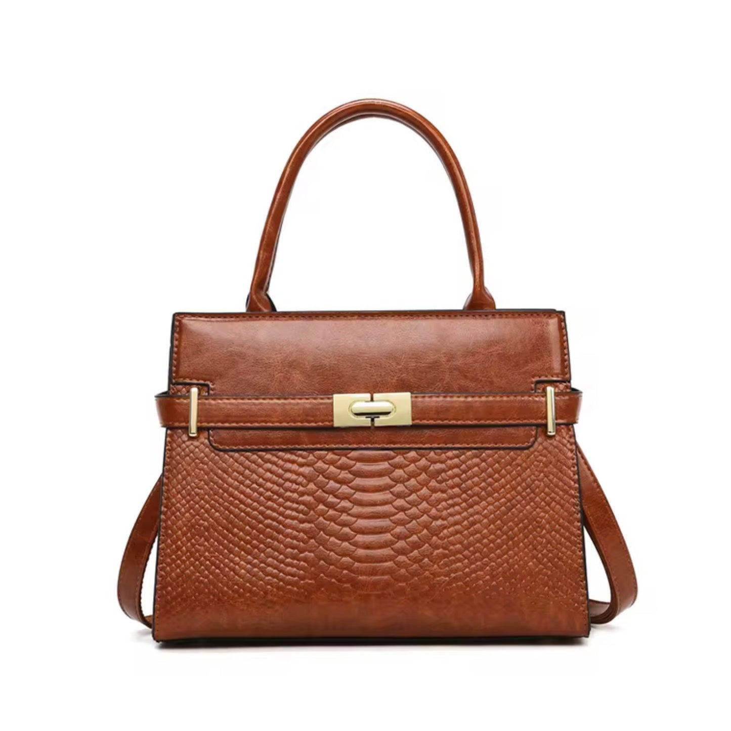 Terra Embossed Carryall Tote Bag - Tan By Tikori London. The upper half featured a smooth polished texture, while the lower half features a luxurious, deep embossed reptilian texture with golden hardware. Bag displaying in a white background. Front of the bag showing on the picture. 