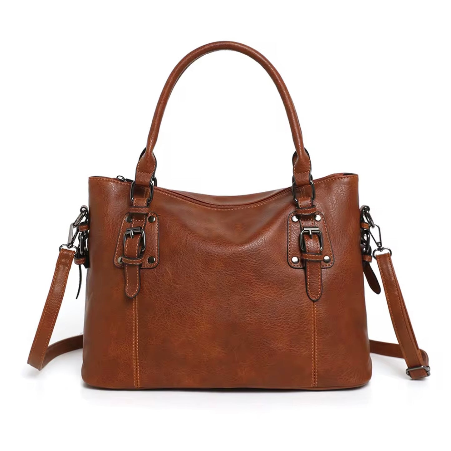 Maven Satchel - Warm Brown by TIKORI LONDON. Front of the bag showing with gun metal hardware in a fully white background. Constructed from deep-brown, pebbled Vintage washed Faux Leather with a supple hand-feel, the Marvin Satchel is as resilient as it is refined.