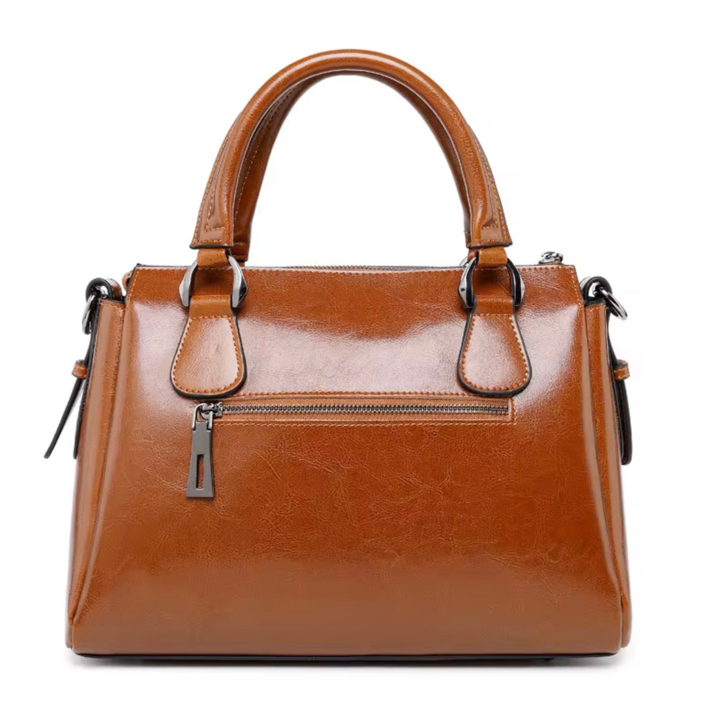 Vintage Brown Polished Satchel Bag - light brown by TIKORI LONDON. Crafted from high quality genuine leather, this bag offers a luxurious aesthetic with a durable finish that stands up to daily wear. Back profile of the bag shows the back pocket zipper details and gun metal hardware in a fully white background.