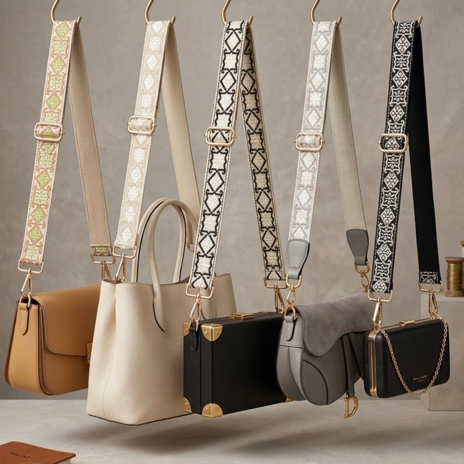 Woven geometric patterned Cross Body Bag Straps By TIKORI london. Soft geometric patterns with sleek design with golden tone hardware. For instance style upgrade. 5straps are attached to beautiful 5 handbags hanging on hooks in a contemporary display. 