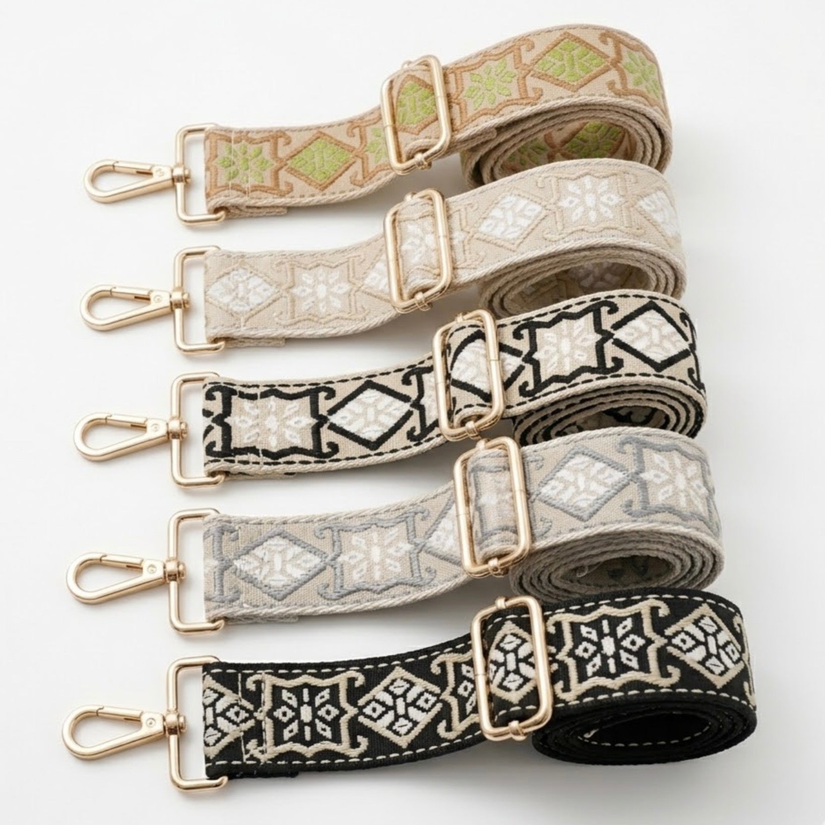 Woven geometric patterned Cross Body Bag Straps By TIKORI london. Soft geometric patterns with sleek design with golden tone hardware. For instance style upgrade. 5 straps displays in a white background 