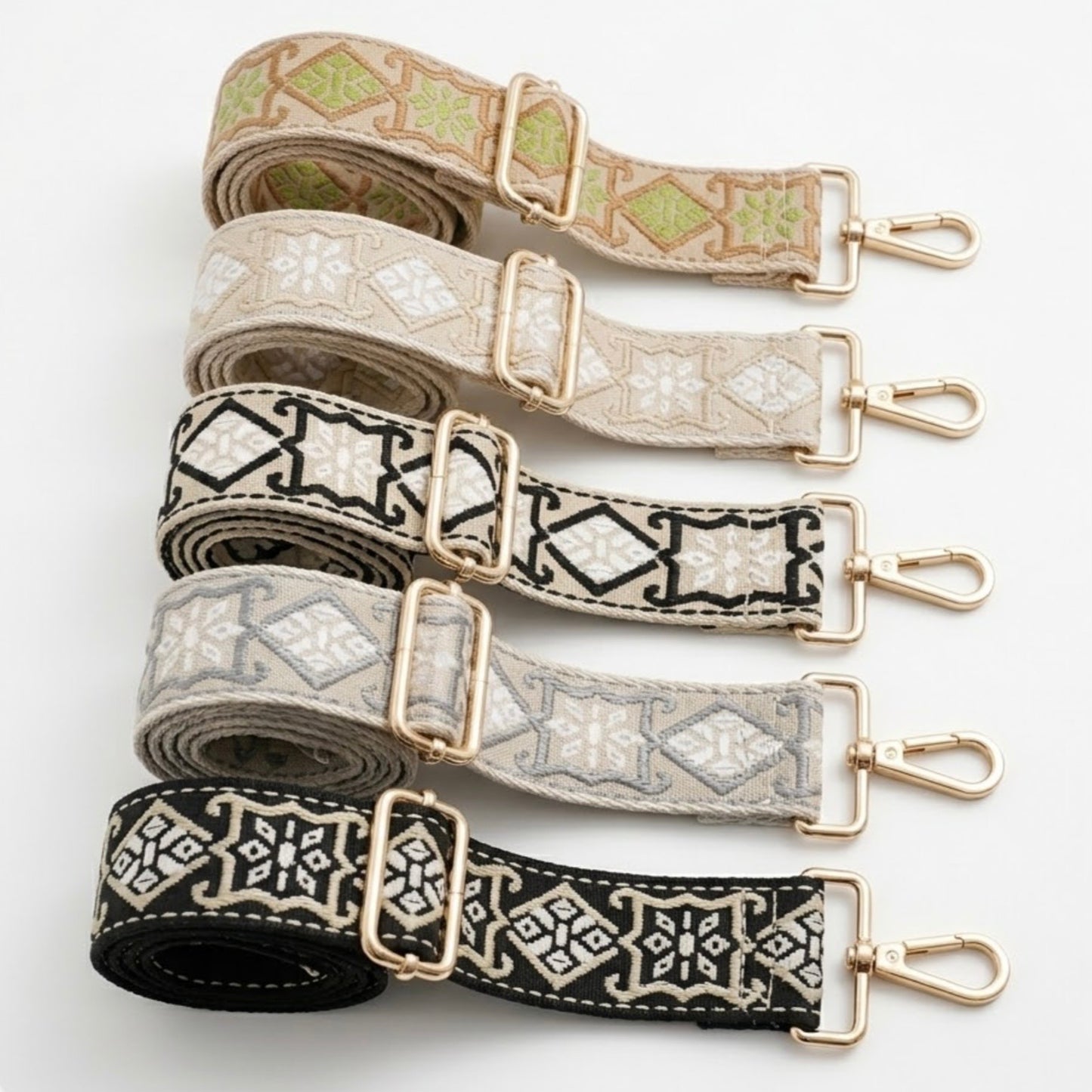 Woven geometric patterned Cross Body Bag Straps By TIKORI london. Soft geometric patterns with sleek design with golden tone hardware. For instance style upgrade. 5 straps displays in a white background 