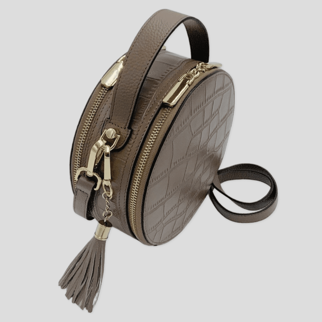 Cleopatra by TIKORI London. Mink leather circle crossbody bag with dual zip fastening, finished leather and stylish design.